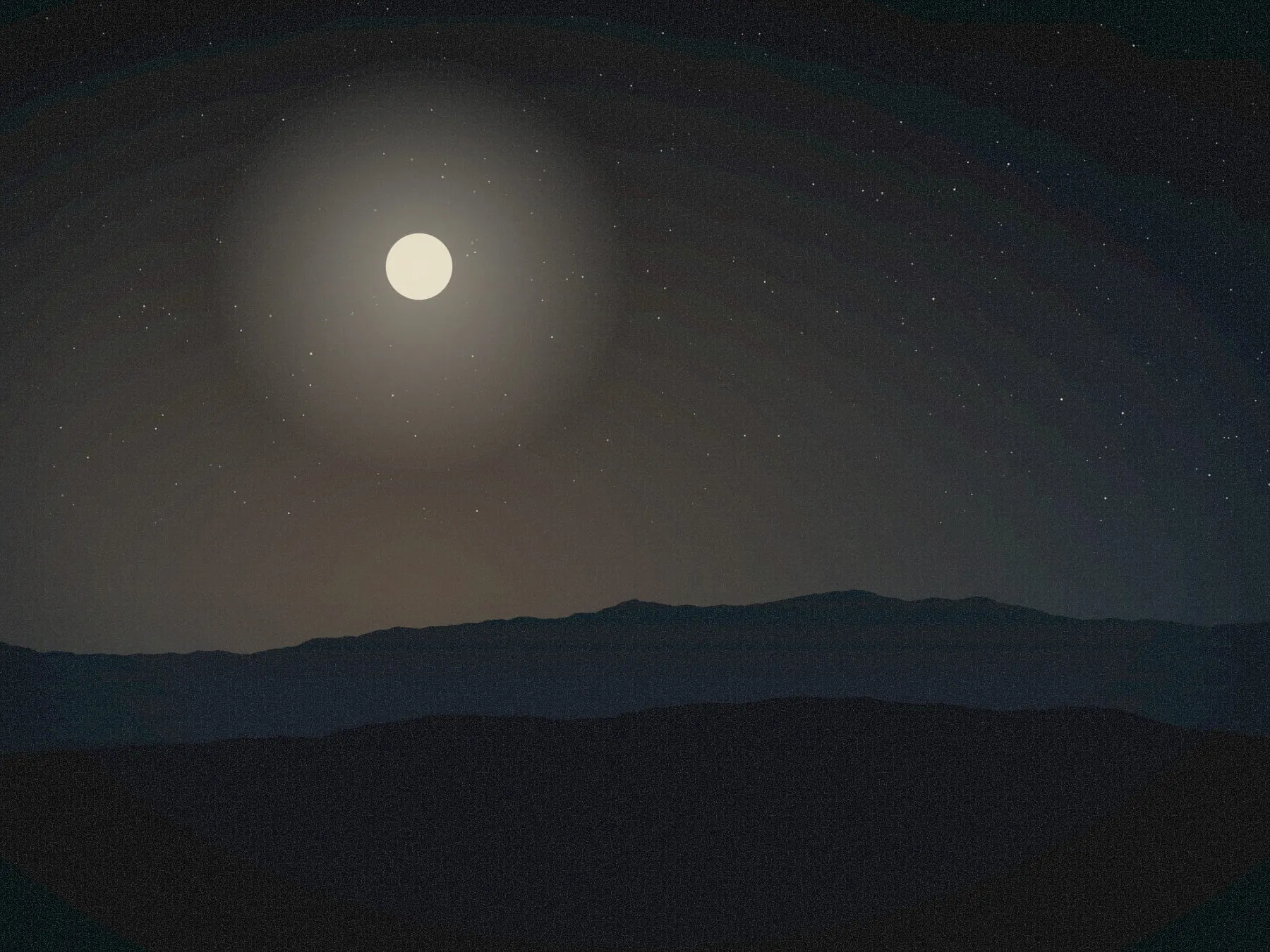 A pale moon above dark hills under a sky dense with stars.